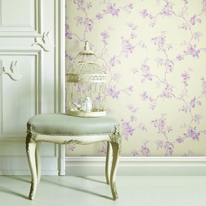 Upholstered stool with ornate bird cage an white dove decorations on a panelled wall