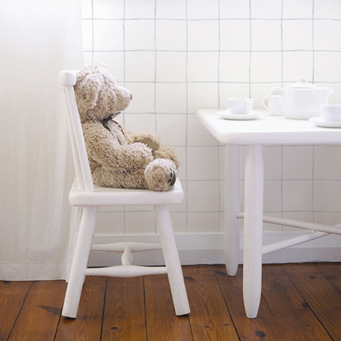 Teddy bear having tea